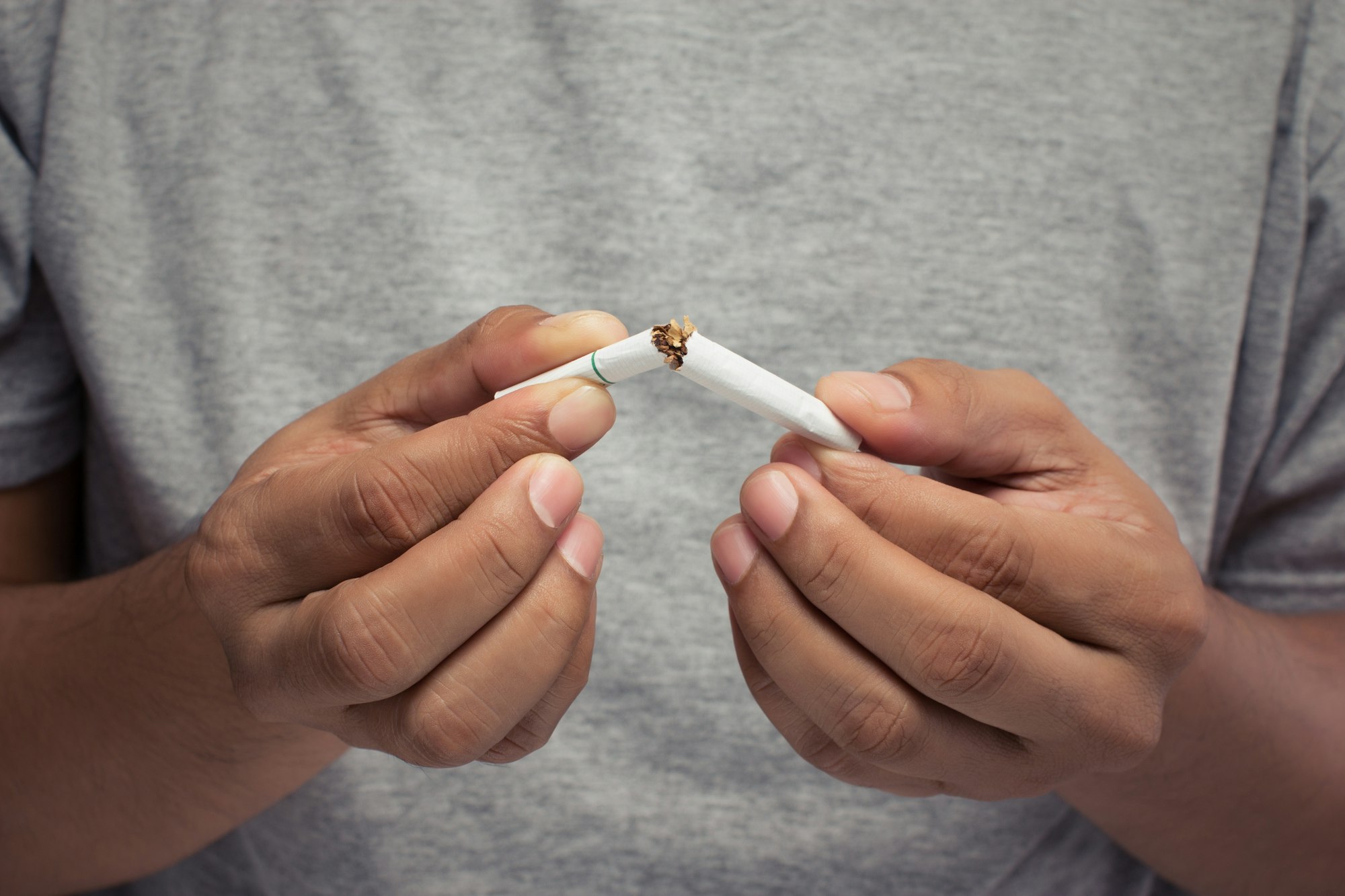 Man hand crushing cigarette, Stop smoking, Concept Quitting smoking,World No Tobacco Day