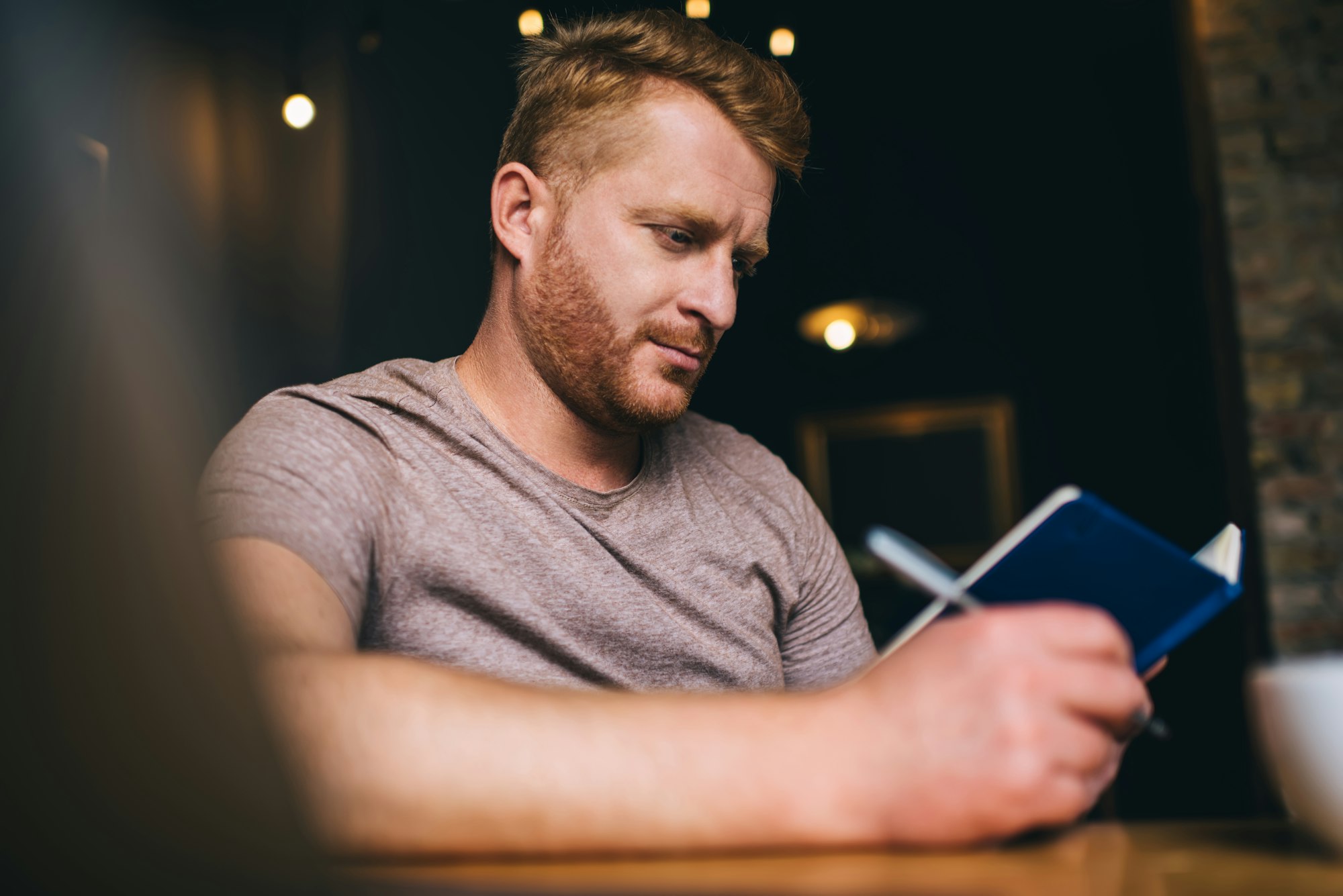 Man reading and taking notes