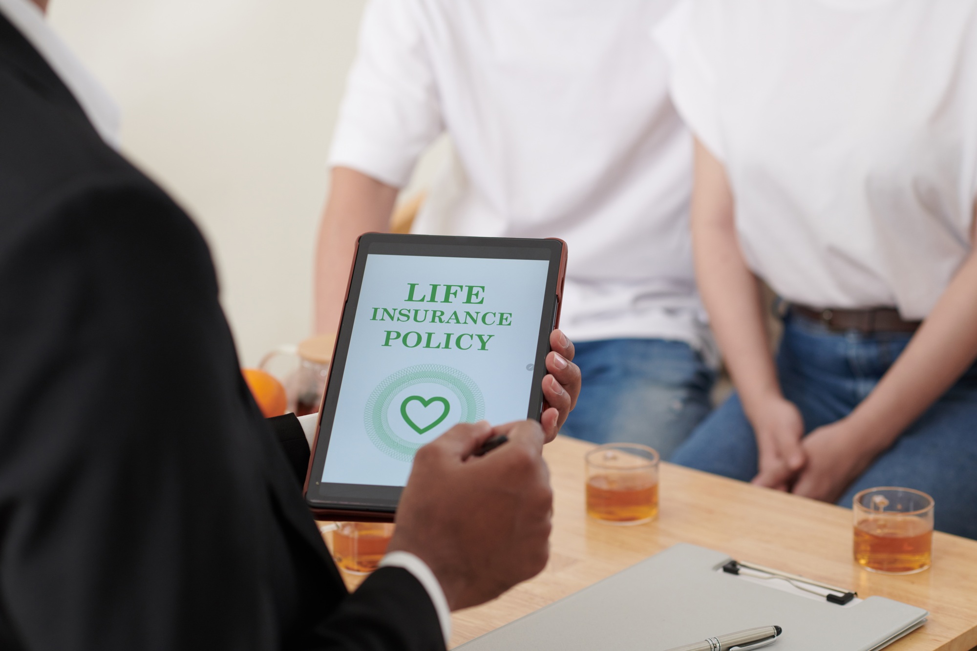 Insurance Agent Talking to Couple