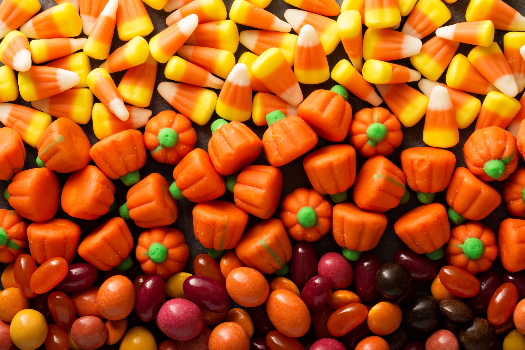 Candy corn and pumpkin Halloween background