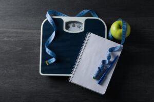 Diet and weight loss, healthy lifestyle, composition with measuring tape