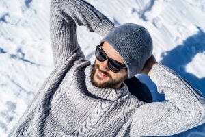 Happy man relaxing in winter