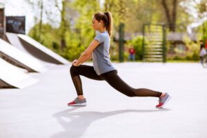 Pretty young woman stretching