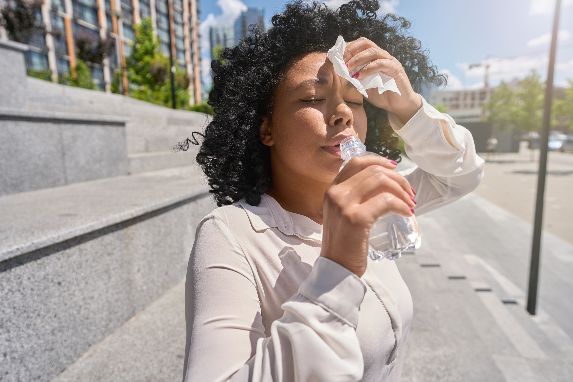 Woman overheated in the sun and dehydrated