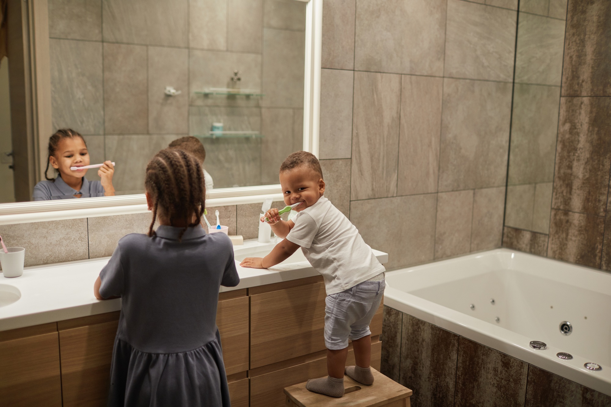 Kids Brushing Teeth in Bathroom